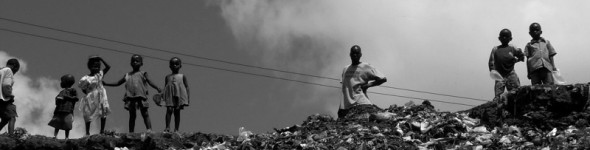 Children-in-Mathare-looking-down-a-hill-of-garbage